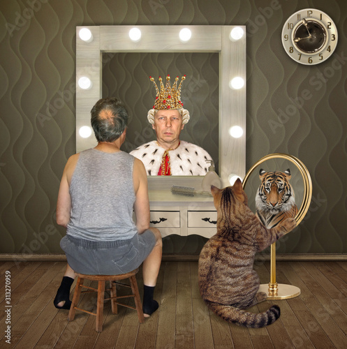 The balding man in a T-shirt and shorts and his cat examine their reflections in the mirrors. The first sees the king, and the second tiger. photo