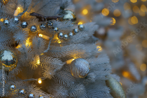 Photography of decoration of  artificial Christmas tree. Bright balls in focus. Concepts of holidays  New Year s Eve  good mood and vacations.