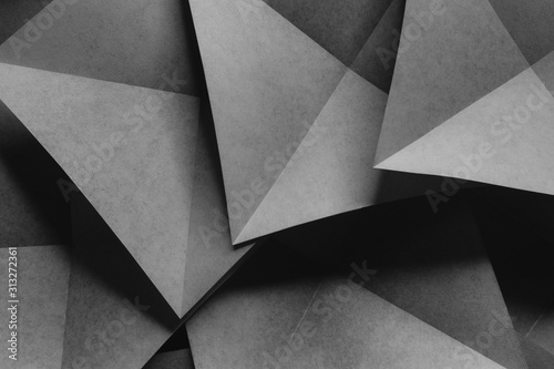 Geometric shapes made paper, dark background.