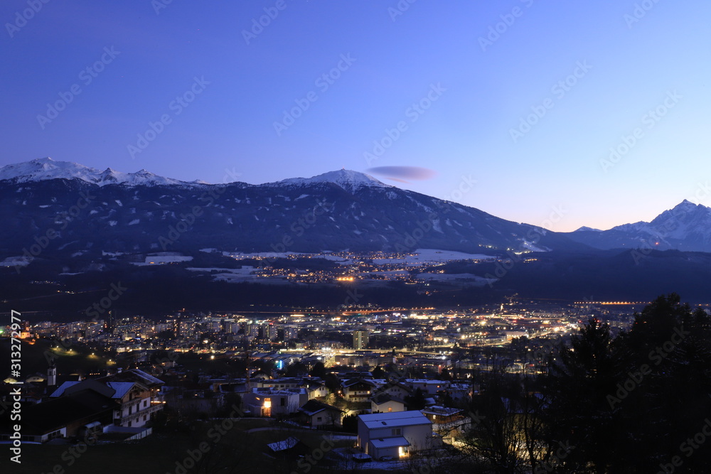 Small Tyrolean town. Snowy Alps in the background