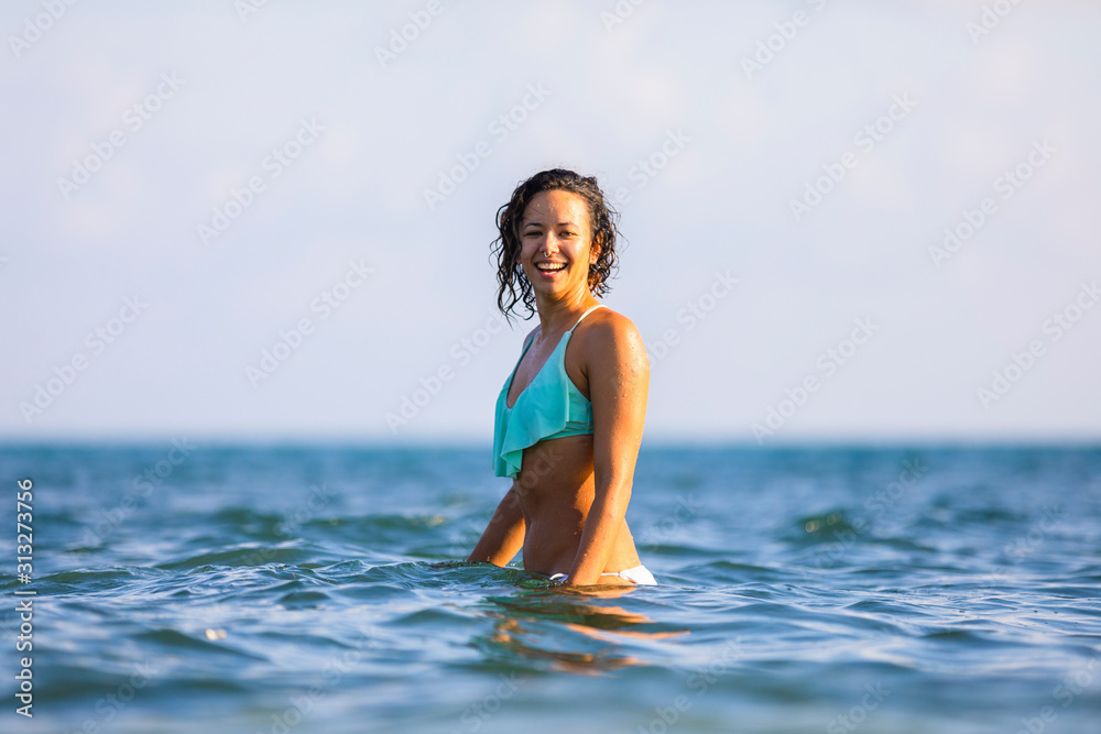 Beautiful model swimming in the ocean