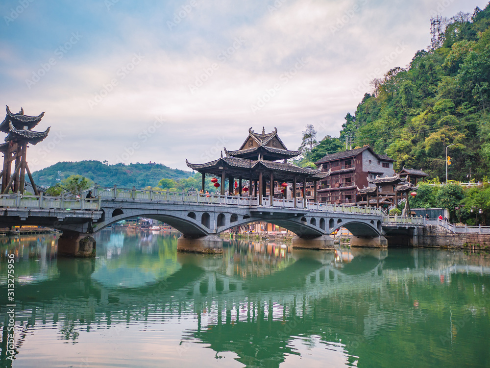 fenghuang,Hunan/China-16 October 2018:Tourist on Fenghuang old town bridge with Scenery view of fenghuang old town .phoenix ancient town or Fenghuang County is a county of Hunan Province, China fenghuang,Hunan/China-16 October 2018:Tourist on Fenghuang old town bridge with Scenery view of fenghuang old town .phoenix ancient town or Fenghuang County is a county of Hunan Province, China