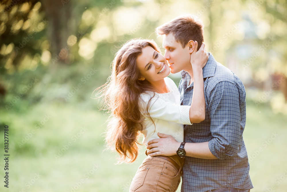 loving couple are hugging in park loving couple are hugging in park