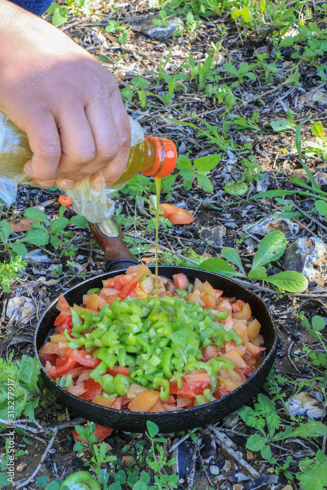 Frying tomatoes in nature
