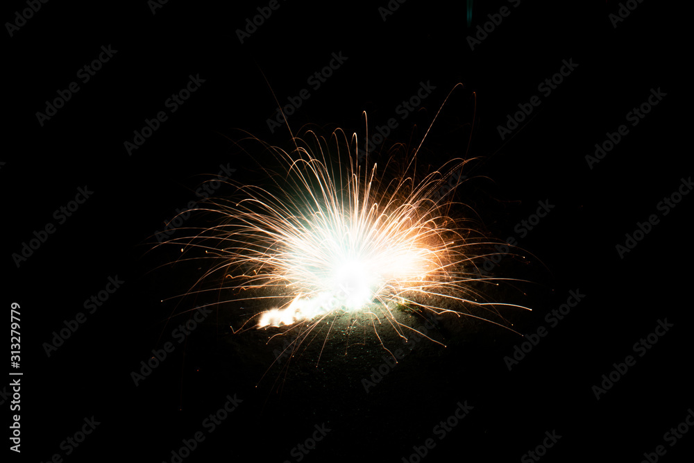 Playing with New Year firecrackers at night, dark background - 1/1/2020