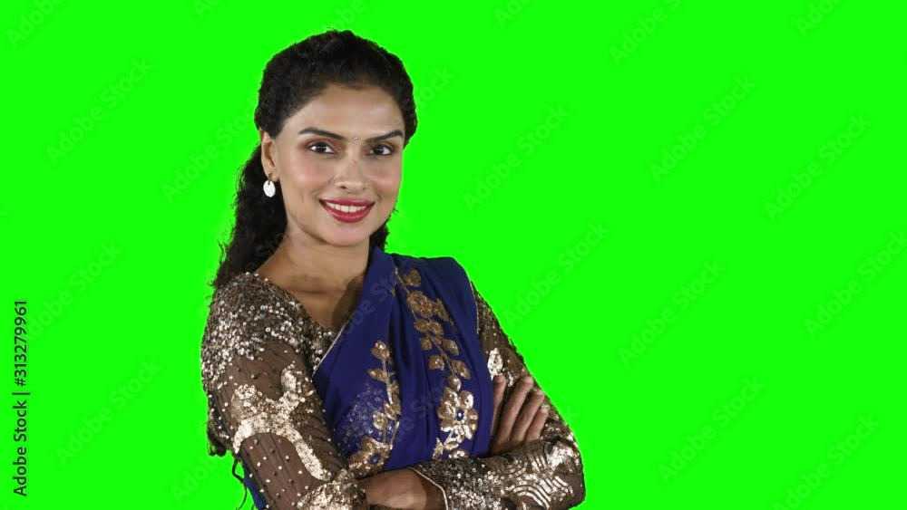 Indian woman smiling at the camera with folded hands Indian woman smiling at the camera with folded hands