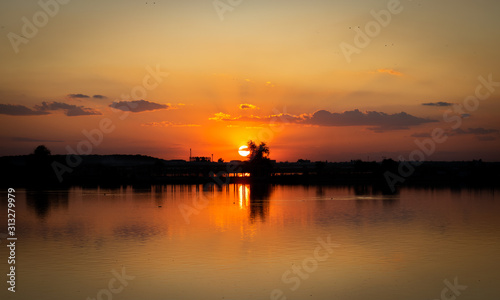 Lacul Morii, Bucharest, Romania - A beautiful sunset over the lake in high contrast © Ehcalahim