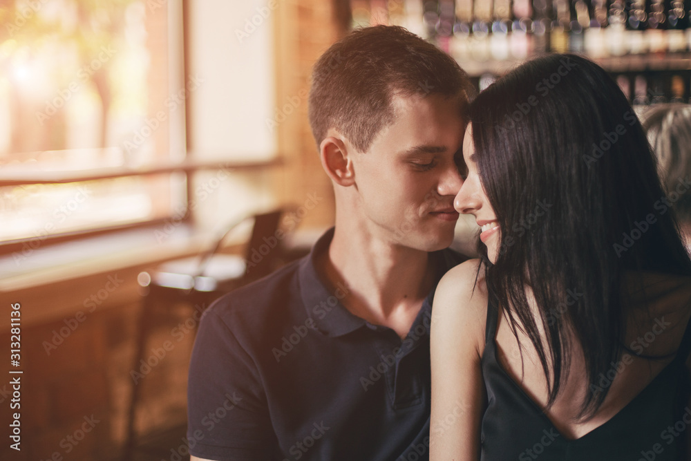 Loving couple hugging in the cafe. Loving couple hugging in the cafe.