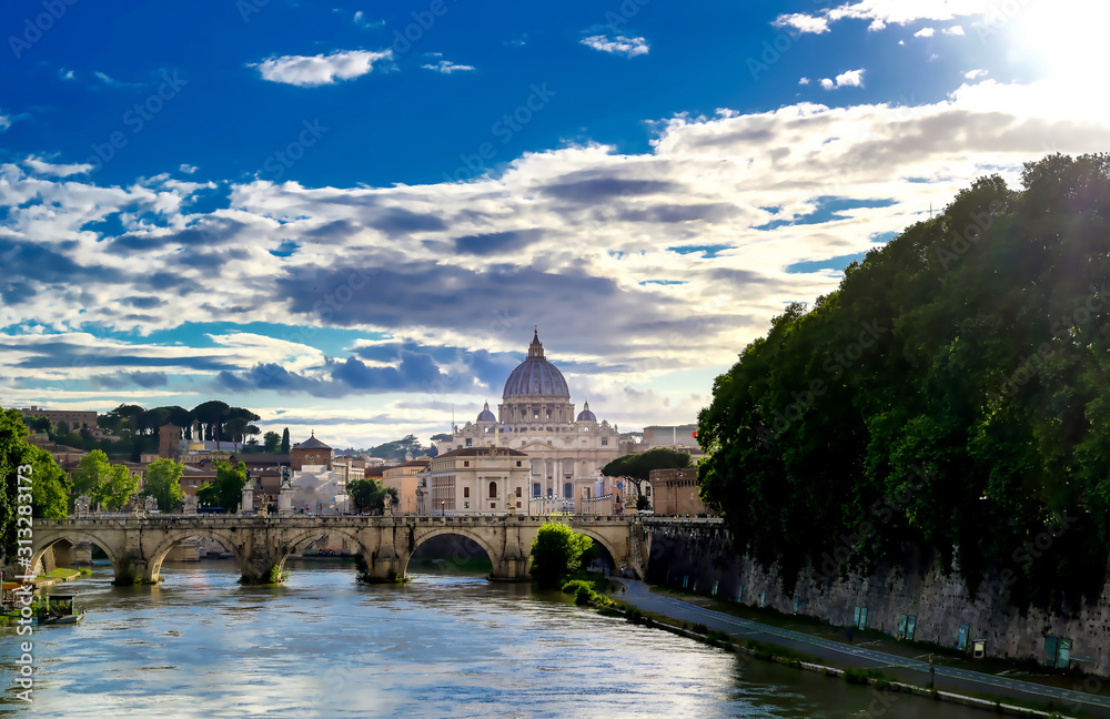A view along the Tiber River towards St. Peter's Basilica in Rome, Italy.