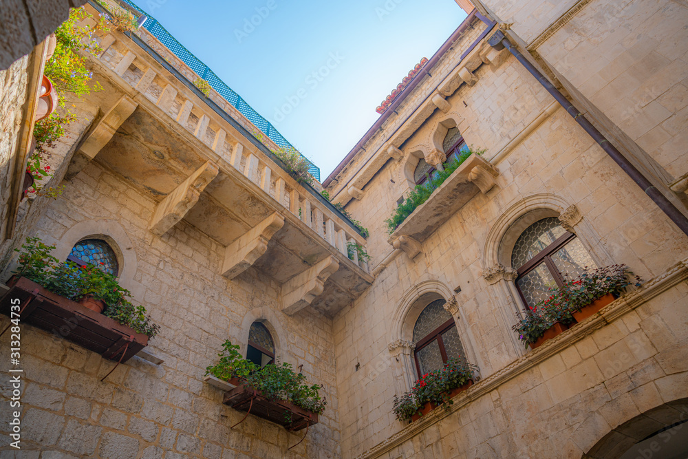 Narrow street in historic town Trogir, Croatia.