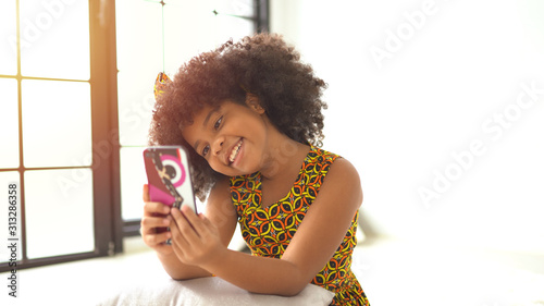 African american girl making a selfie on a mobile phone.