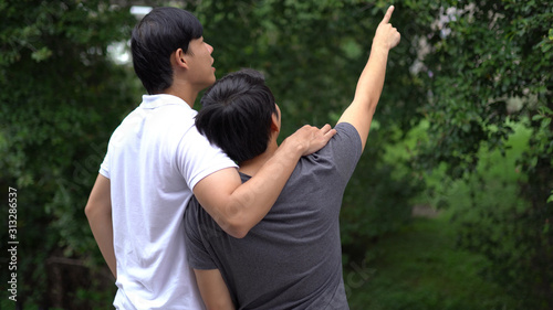 Asian gay couple happy outdoor