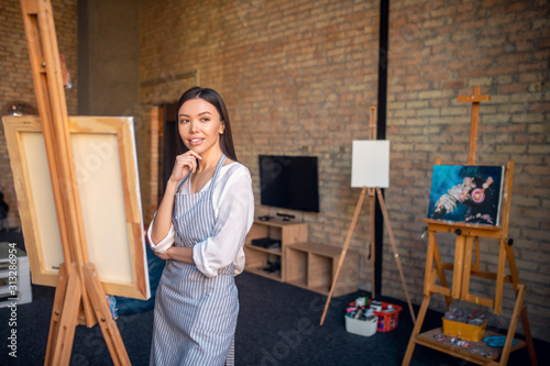 Pretty thoughtful young woman looking for inspiration