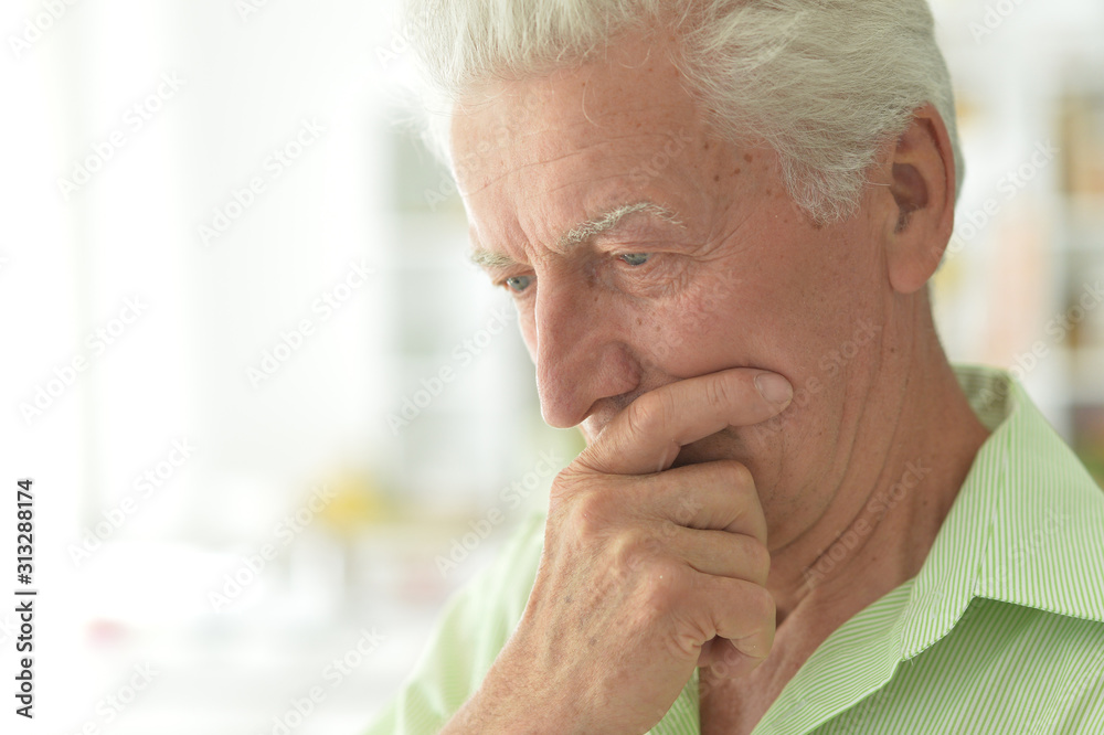 Portrait of thoughtful senior man at home Portrait of thoughtful senior man at home
