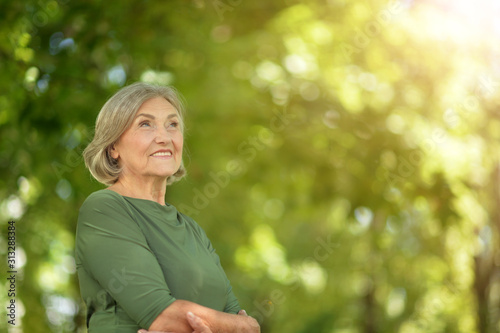 Quadro em tela Happy senior beautiful woman in spring park
