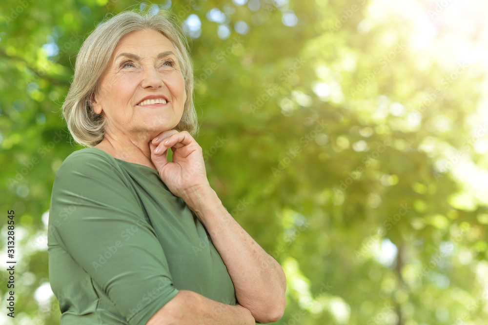 Happy senior beautiful woman in spring park Happy senior beautiful woman in spring park