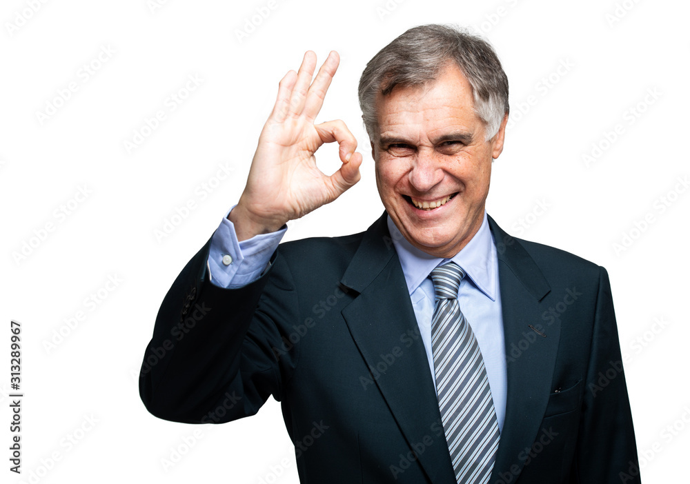 Senior grey-haired businessman wearing suit standing over isolated white background smiling positive doing ok sign with hand and fingers. Successful expression. Senior grey-haired businessman wearing suit standing over isolated white background smiling positive doing ok sign with hand and fingers. Successful expression.