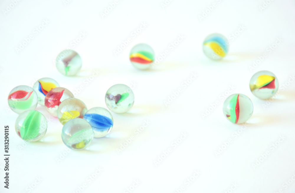 colorful glass balls in white background colorful glass balls in white background