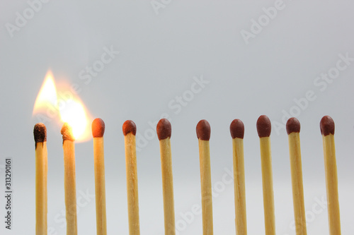 burning match on white background