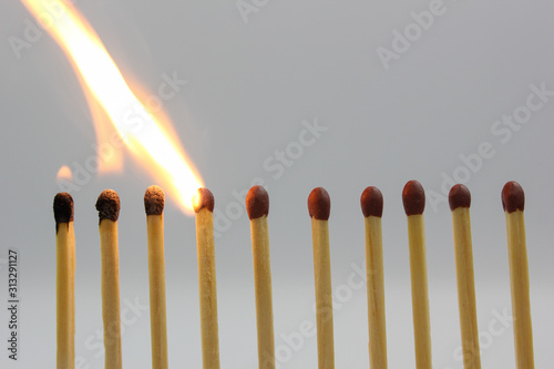 burning match on white background
