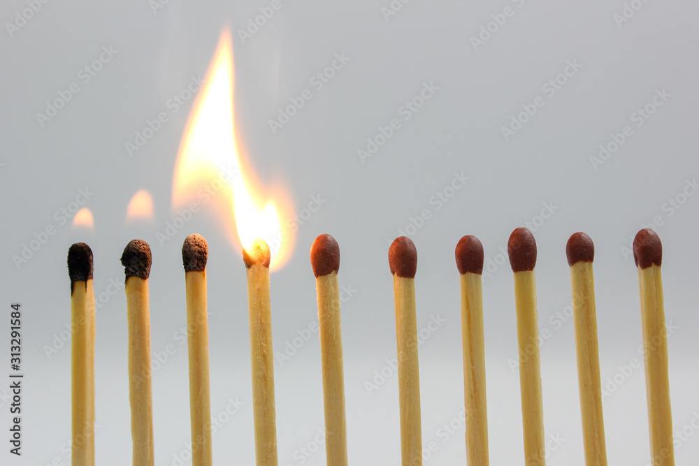 burning match on white background burning match on white background
