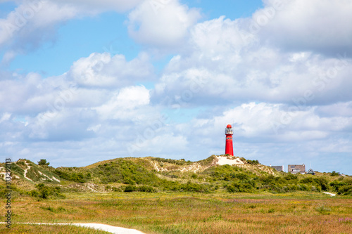 The north tower, lighthouse on the Nord Sea side at the wadden island Schiermonnikoog in the Netherlands photo