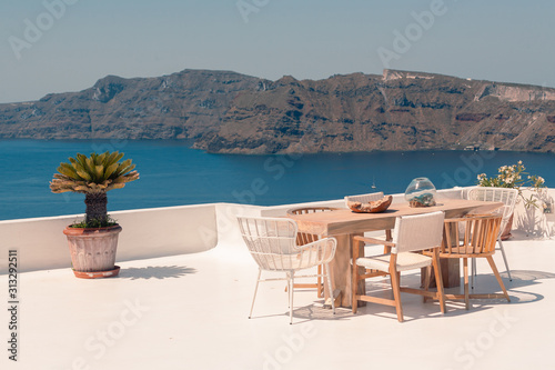 Classical view on the decoration and architecture of Oia village Santorini at sun weather © STUDIO MELANGE