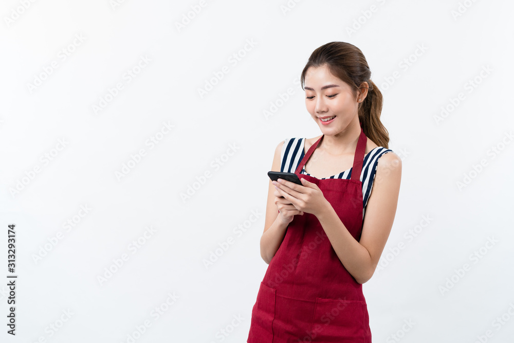 Young Asian woman cafe owner feeling happy using cellphone to advertise through social media or manage electronic banking, isolate with white background, small business owner, young confident woman Young Asian woman cafe owner feeling happy using cellphone to advertise through social media or manage electronic banking, isolate with white background, small business owner, young confident woman