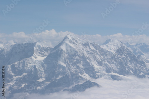Photography A beautiful photo of a mountain with glacier and snow on it from a height above