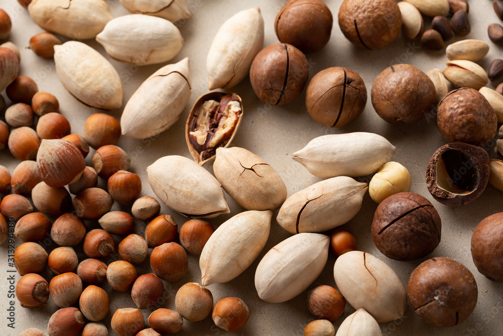 Fresh nut assortment top view, pecan and hazelnuts