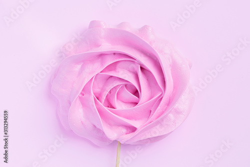 Pink Rose meringues in pastel colors on a pink background. Valentine, Mom's Day.Medicine. Women Health