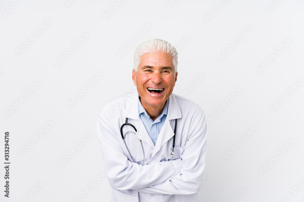 Mature caucasian doctor man laughing and having fun. Mature caucasian doctor man laughing and having fun.
