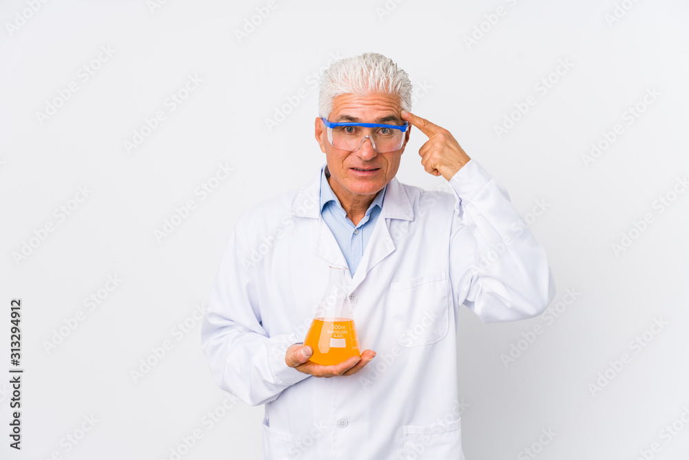 Mature chemical man isolated showing a disappointment gesture with forefinger. Mature chemical man isolated showing a disappointment gesture with forefinger.
