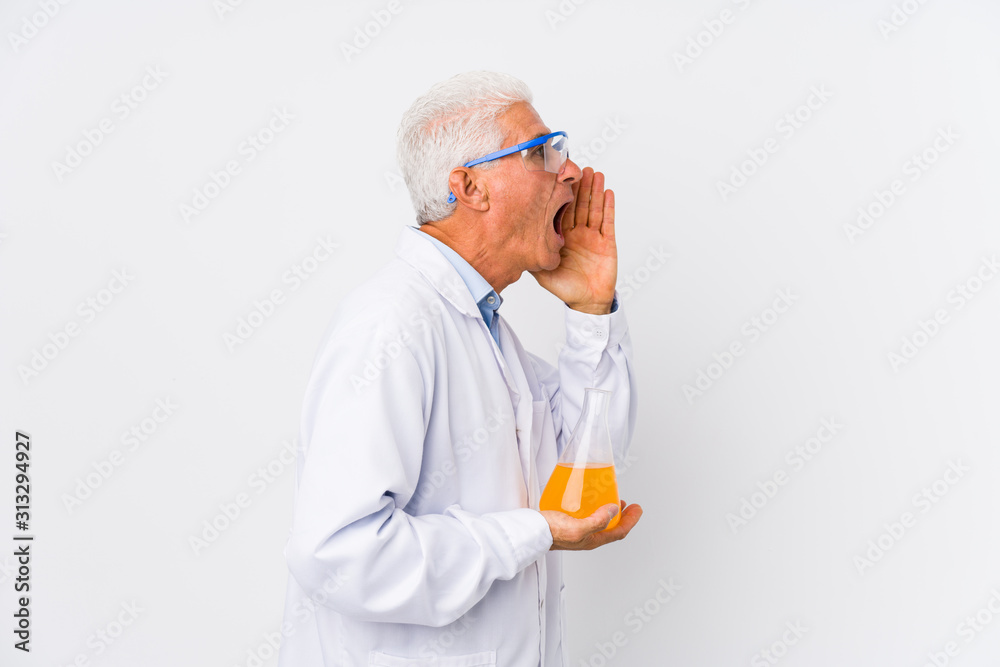 Mature chemical man isolated shouting and holding palm near opened mouth. Mature chemical man isolated shouting and holding palm near opened mouth.