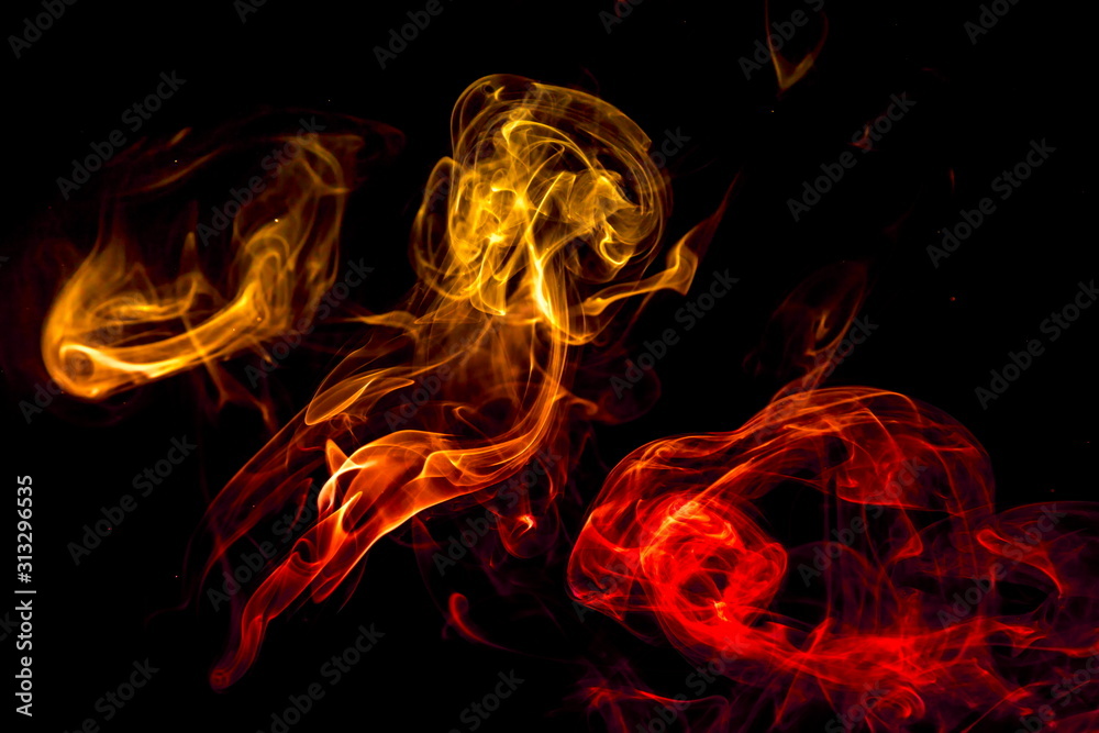 Fototapeta premium Colored smoke on black background