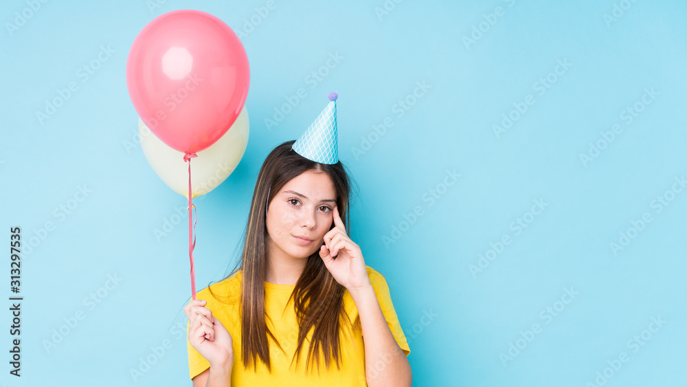 Young caucasian woman organizing a birthday isolated Young caucasian woman organizing a birthday isolated