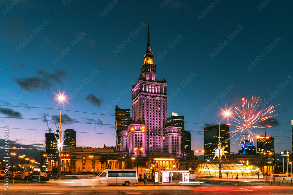 WARSAW / POLAND - 31 December 2019: The Palace of Science and Art during New Year celebration with fireworks, motion blur.