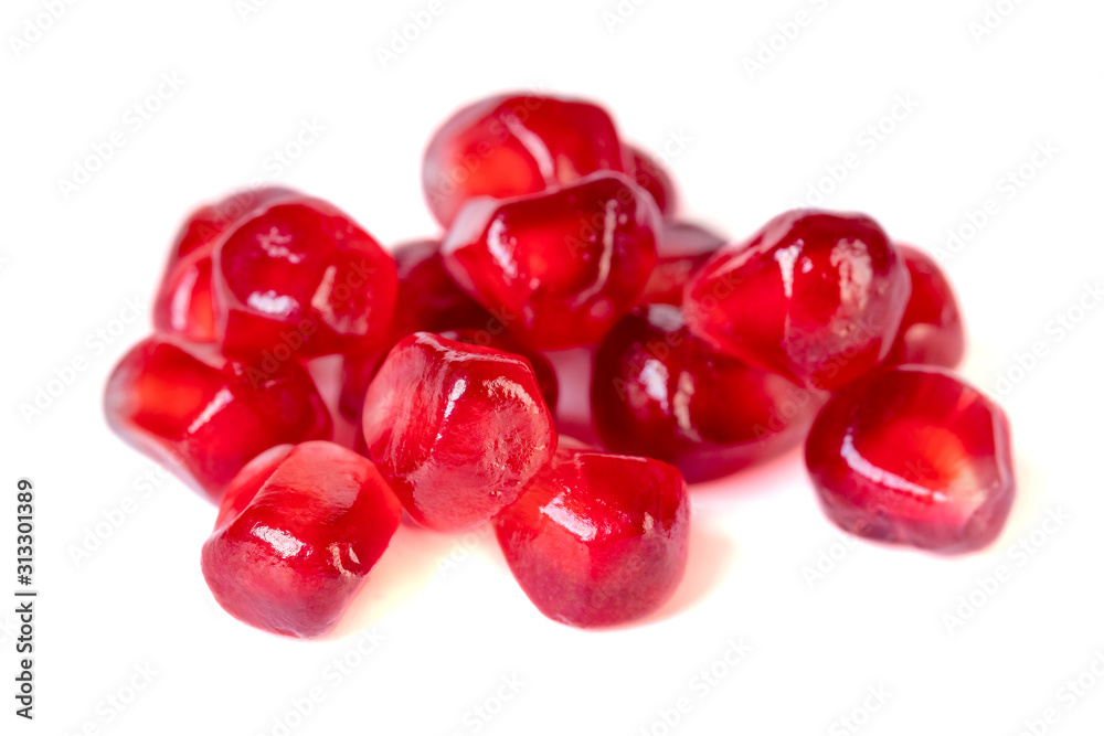 Fresh pomegranate seeds isolated on white background. Close up.