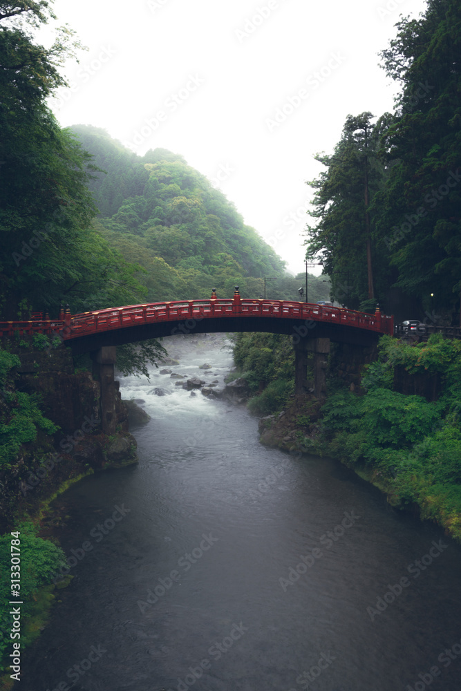 Image of Japanese Bridge with River Underneath during Moody Cloudy and Misty Weather Image of Japanese Bridge with River Underneath during Moody Cloudy and Misty Weather