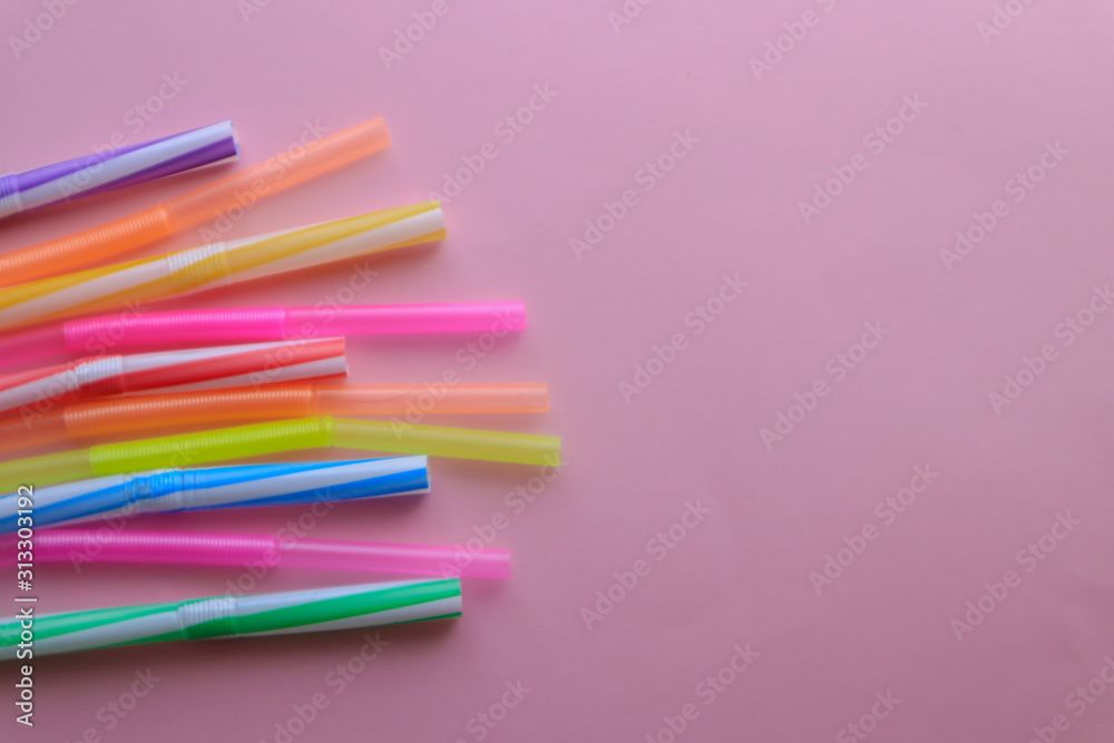 Plastic cocktail straws on color background Plastic cocktail straws on color background