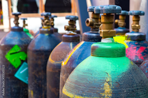 Cylinders with technical gases. Fragment of a cylinder with oxygen. Tanks for liquid oxygen. Production of gas bottles. Buy gaseous oxygen. Fuel equipment. Equipment for small production