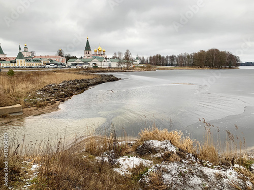 Valdai Iversky Svyatoozersky Bogoroditsky monastery in winter in cloudy weather. Russia, Novgorod region photo