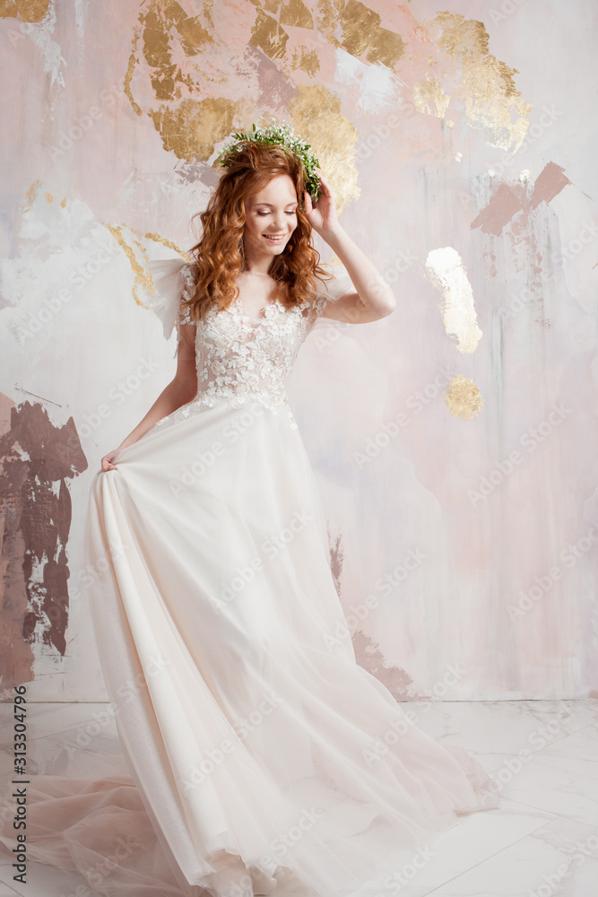 Elegant red-haired girl bride. Young beautiful woman in wedding dress Elegant red-haired girl bride. Young beautiful woman in wedding dress