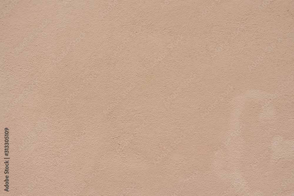 background or texture. Decorative plaster on the wall. Sand color beige background or texture. Decorative plaster on the wall. Sand color beige