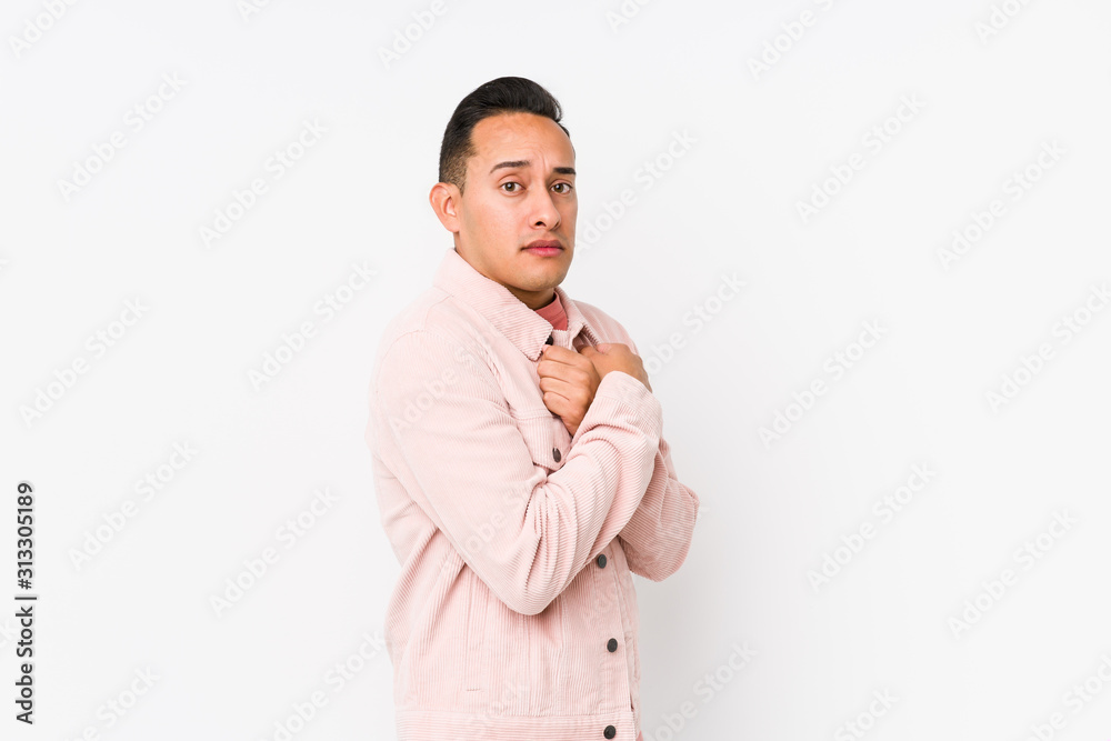 Young latin man posing isolated scared and afraid. Young latin man posing isolated scared and afraid.