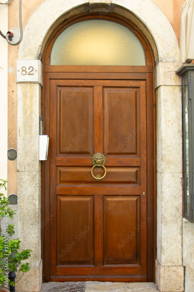 Italian Door. Wooden Italian Door in Historic Center of the City of Taormina Italian Door. Wooden Italian Door in Historic Center of the City of Taormina
