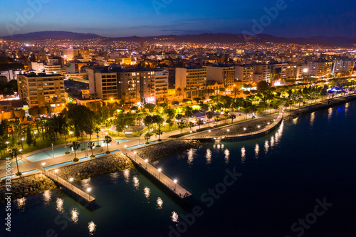 Cyprus. Limassol. Limassol city promenade at night. Walks along the evening promenade. Traveling around the cities of Cyprus. Limassol embankment with a drone. Holidays in the Mediterranean.