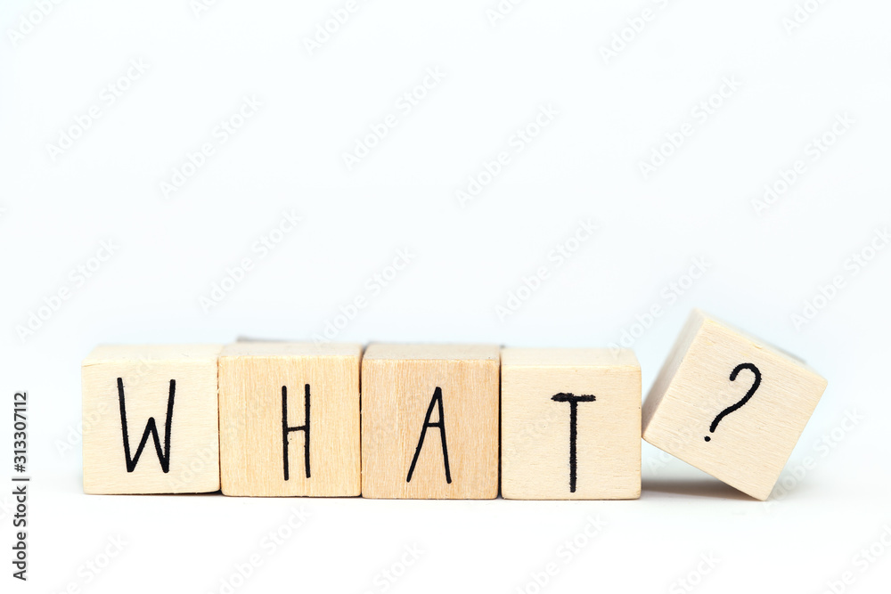 Wooden cubes with the word What and a question mark isolated on white background Wooden cubes with the word What and a question mark isolated on white background