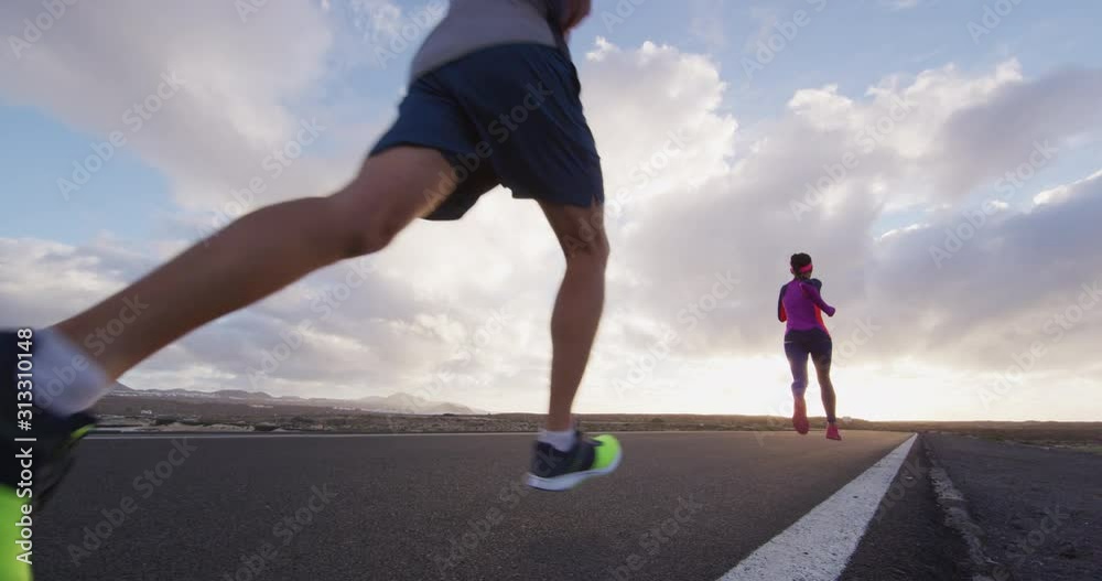 Running people low angle view in slow motion of sport fitness people on training run running fast.