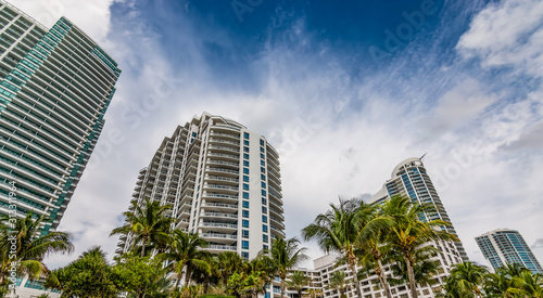 Bottom view of high rise buildings and modern skyscrapers at the coastline of Hollywood beach. Broward County real estate concept. © Nancy Pauwels